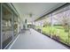 Spacious screened porch with swing and pond view at 3127 Ivyhill Ct, Holiday, FL 34691