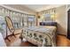 Bedroom with large window and wood floors at 37015 Sandra Ave, Zephyrhills, FL 33542