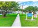 Community clubhouse with welcoming landscaping at 37015 Sandra Ave, Zephyrhills, FL 33542