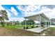 Relaxing community pavilion with benches overlooking a lake at 37015 Sandra Ave, Zephyrhills, FL 33542