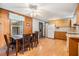 Dining area with wood table and chairs, view of kitchen at 37015 Sandra Ave, Zephyrhills, FL 33542