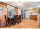 Dining area with wood table and chairs near kitchen at 37015 Sandra Ave, Zephyrhills, FL 33542