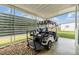 Golf cart parked under covered carport at 37015 Sandra Ave, Zephyrhills, FL 33542