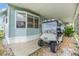 Golf cart parked under covered carport at 37015 Sandra Ave, Zephyrhills, FL 33542