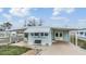 Mobile home with carport and well-maintained landscaping at 37015 Sandra Ave, Zephyrhills, FL 33542