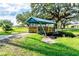 Charming blue footbridge crossing a tranquil waterway at 37015 Sandra Ave, Zephyrhills, FL 33542
