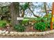 Vibrant garden with decorative elements at 37015 Sandra Ave, Zephyrhills, FL 33542