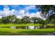 Scenic golf course with pond and trees at 37015 Sandra Ave, Zephyrhills, FL 33542