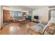 Living room features wood floors and ample natural light at 37015 Sandra Ave, Zephyrhills, FL 33542