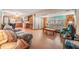 Bright living room with wood floors and comfy furniture at 37015 Sandra Ave, Zephyrhills, FL 33542