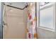 Shower stall with shower curtain and window at 37015 Sandra Ave, Zephyrhills, FL 33542