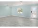 Spacious living room with light blue walls and grey tile floors at 410 Clarissa Dr, Brandon, FL 33511