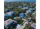 Expansive aerial shot of neighborhood showcasing tree-lined streets and beautiful homes near the ocean at 4820 W San Jose St, Tampa, FL 33629