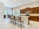 Modern kitchen with granite countertops and dark wood cabinets at 4903 Diamonds Palm Loop, Wesley Chapel, FL 33543