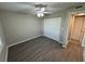 Second bedroom with large closet and wood-look floors at 5035 Bordeaux Village Pl # 101, Tampa, FL 33617