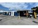 Blue commercial building with parking lot and signage at 5035 Bordeaux Village Pl # 101, Tampa, FL 33617