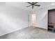 Bright bedroom with ceiling fan and ample closet space at 6070 Oakhurst Dr, Seminole, FL 33772