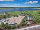 Aerial view of community features a lake, playground, and walking paths at 6123 Hidden Branch Dr, Apollo Beach, FL 33572