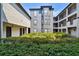 Residential courtyard with lush landscaping and building at 8517 Island Breeze Ln # 207, Temple Terrace, FL 33637