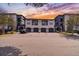 Two-story building with attached garages and parking at 8517 Island Breeze Ln # 207, Temple Terrace, FL 33637