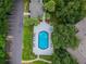Community pool with patio and lounge chairs at 8517 Island Breeze Ln # 207, Temple Terrace, FL 33637