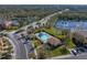 Community pool and surrounding area with lake at 8958 White Sage Loop, Lakewood Ranch, FL 34202