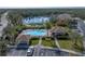 Community pool and surrounding buildings with lake view at 8958 White Sage Loop, Lakewood Ranch, FL 34202