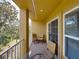 Relaxing balcony with outdoor seating and lush treetop views at 8958 White Sage Loop, Lakewood Ranch, FL 34202