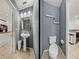 Small half bathroom with pedestal sink and toilet at 8958 White Sage Loop, Lakewood Ranch, FL 34202