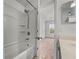 Bathroom with tub and shower, plus bedroom view at 8958 White Sage Loop, Lakewood Ranch, FL 34202