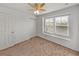Bedroom with ceiling fan, double closet and window at 8958 White Sage Loop, Lakewood Ranch, FL 34202