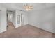 Second bedroom with plush carpet and access to the bathroom at 8958 White Sage Loop, Lakewood Ranch, FL 34202