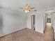 Spacious bedroom with ceiling fan and ensuite bathroom at 8958 White Sage Loop, Lakewood Ranch, FL 34202