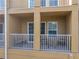 Two covered balconies with white railings, offering outdoor space at 8958 White Sage Loop, Lakewood Ranch, FL 34202