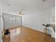 Bright living room featuring hardwood floors and large windows at 8958 White Sage Loop, Lakewood Ranch, FL 34202