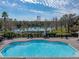 Relaxing community pool area with lake view at 8958 White Sage Loop, Lakewood Ranch, FL 34202