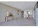 Bright dining area with tile floors and view into kitchen at 9 Haig Pl # 707, Dunedin, FL 34698