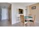 Small dining area with table and chairs near entryway at 9 Haig Pl # 707, Dunedin, FL 34698