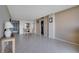 Living room with tiled floors and dining area view at 9 Haig Pl # 707, Dunedin, FL 34698