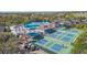 Community pickleball courts with nearby pool and lounge area at 951 Villeroy Greens Dr, Sun City Center, FL 33573