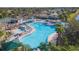 Resort-style pool with plenty of lounge chairs and umbrellas at 951 Villeroy Greens Dr, Sun City Center, FL 33573