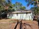 Light green house exterior with mature trees and yard at 1005 E Fern St, Tampa, FL 33604