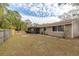 House exterior and backyard with grassy area at 102 Shoreview Ln, Oldsmar, FL 34677