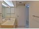 Bathroom with single sink vanity, and access to another room at 102 Shoreview Ln, Oldsmar, FL 34677