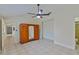 Spacious bedroom with tile floors and a large wardrobe at 102 Shoreview Ln, Oldsmar, FL 34677