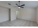 Spacious bedroom with tile floors and ceiling fan at 102 Shoreview Ln, Oldsmar, FL 34677