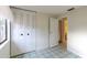 Bedroom with tile floors and built-in closet at 102 Shoreview Ln, Oldsmar, FL 34677