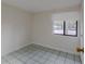 Bright bedroom with tile flooring and a window at 102 Shoreview Ln, Oldsmar, FL 34677