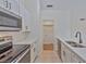 Modern white kitchen with stainless steel appliances at 102 Shoreview Ln, Oldsmar, FL 34677