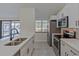Updated kitchen featuring stainless steel appliances and white cabinets at 102 Shoreview Ln, Oldsmar, FL 34677
